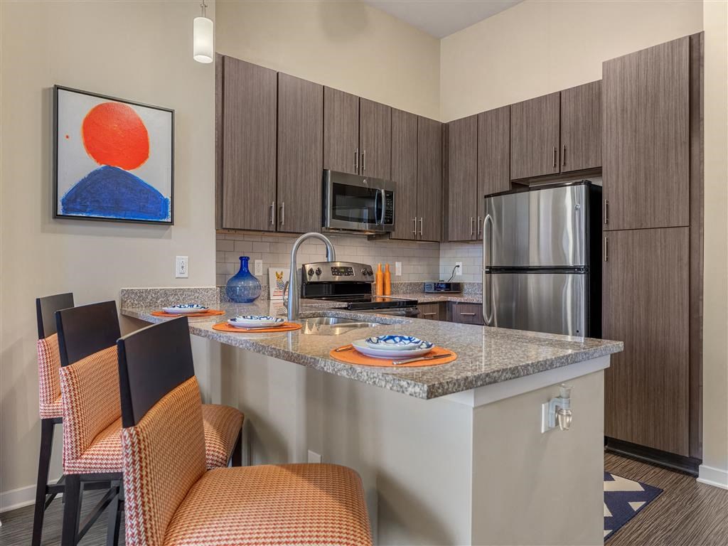 a kitchen with a granite counter top and a