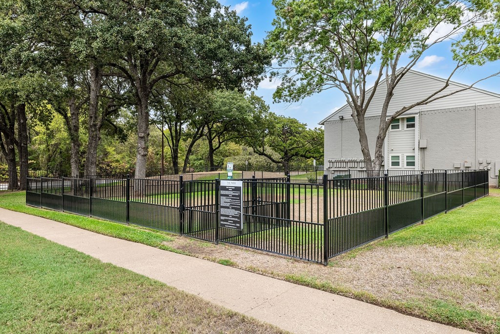 a wrought iron fence in front of a house