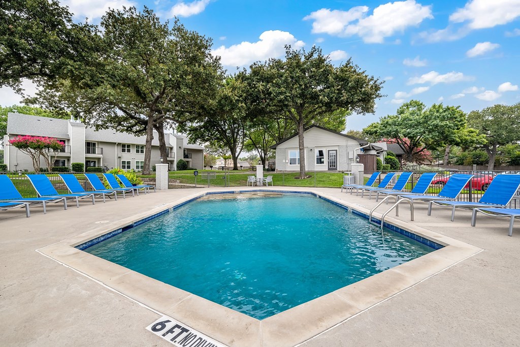 our apartments have a resort style pool and lounge chairs