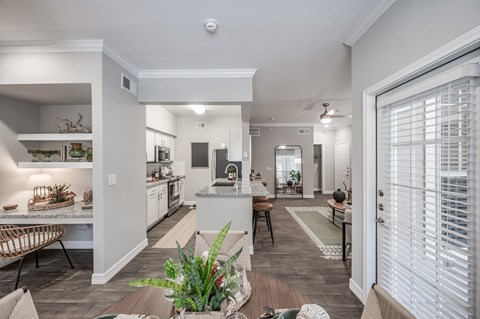 A modern kitchen with a dining table and chairs.