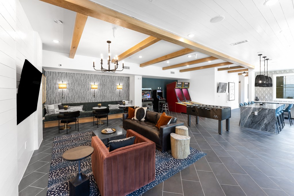 a living room with furniture and a pool table