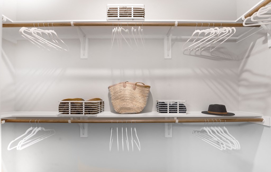 spacious walk in closest with storage bins