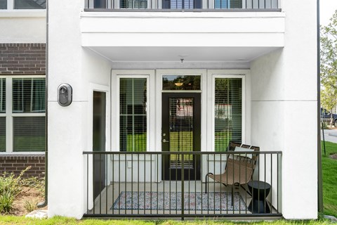 fenced in patio on the model apartment