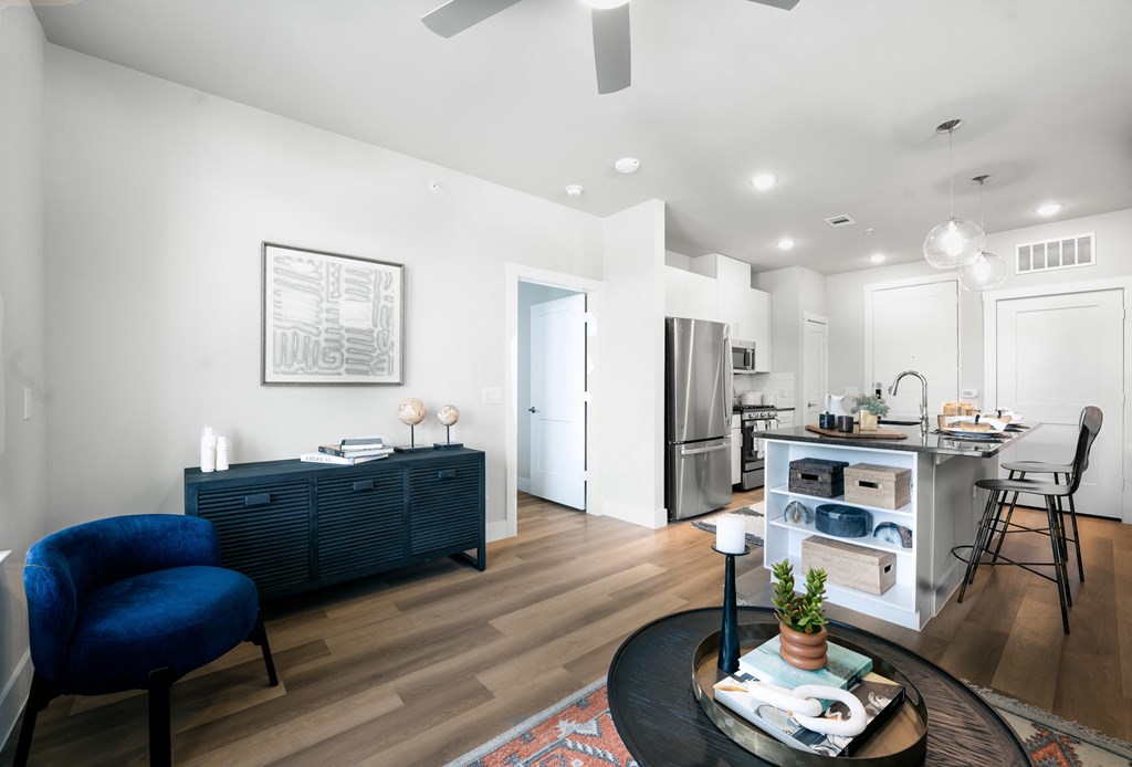 spacious living bedroom with wood-style flooring
