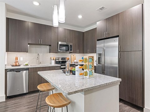 a kitchen with a counter top and a refrigerator