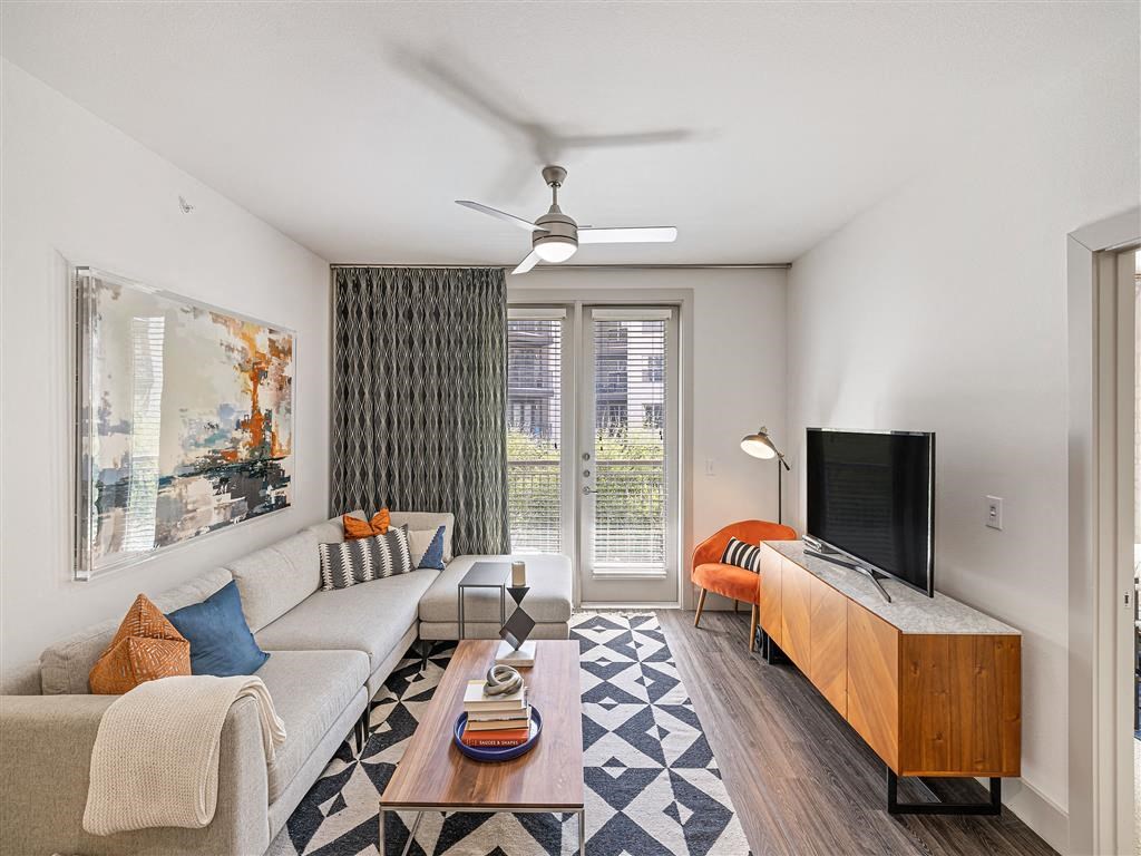a living room with a couch and a tv