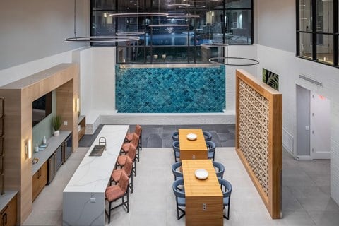 A modern dining area with a long table and chairs.