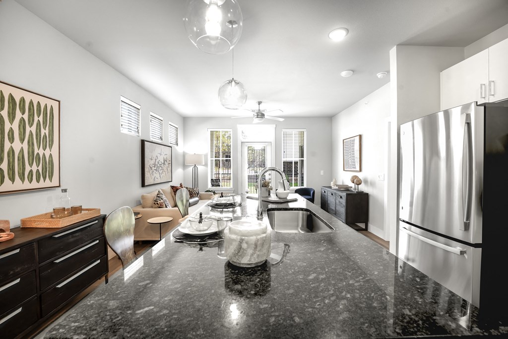 a kitchen with a large counter top and a sink