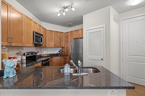 a kitchen with granite counter tops and a sink