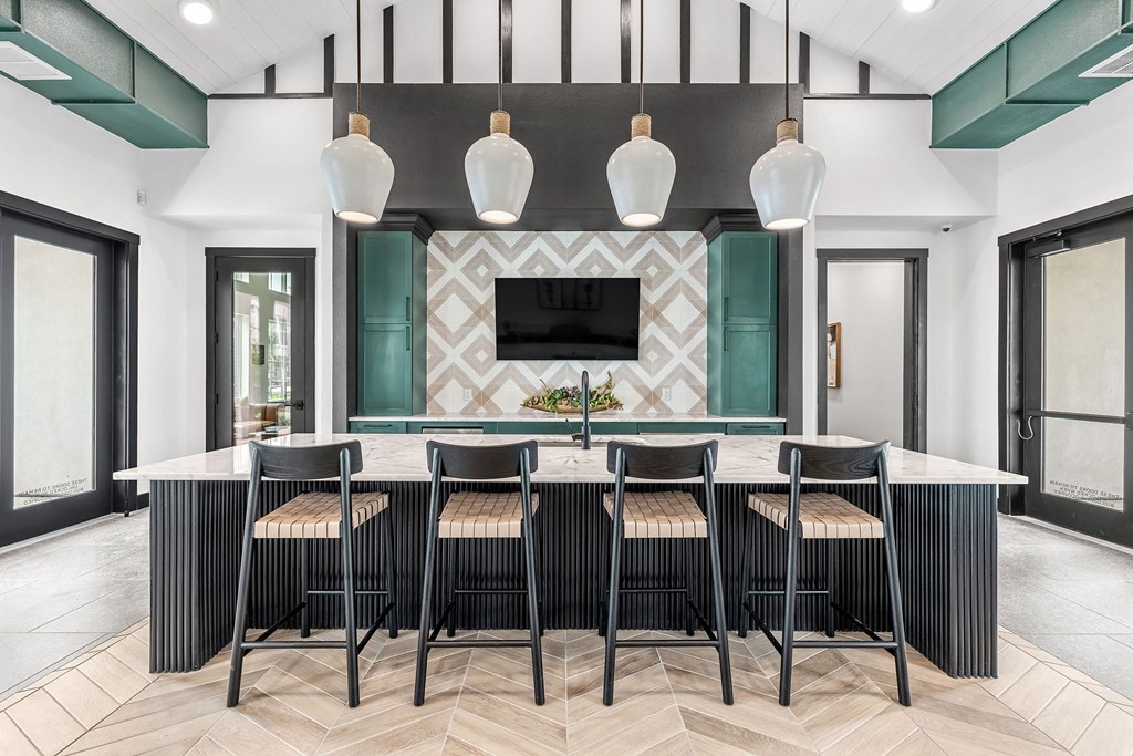 a dining room with a table and chairs and a tv