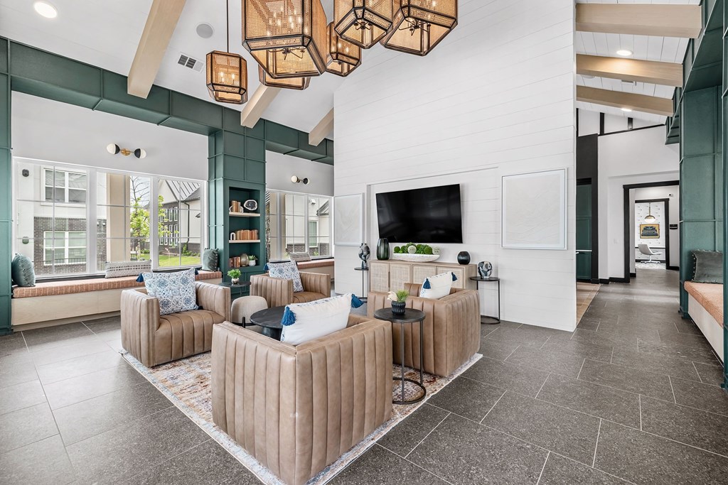 a living room with couches and a tv