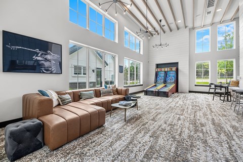 the preserve at gateway living room with couches and games