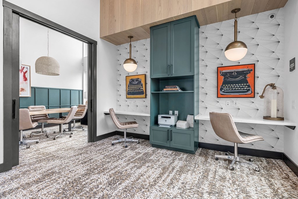 a barbershop with chairs and a nail salon with blue cabinets and white hex