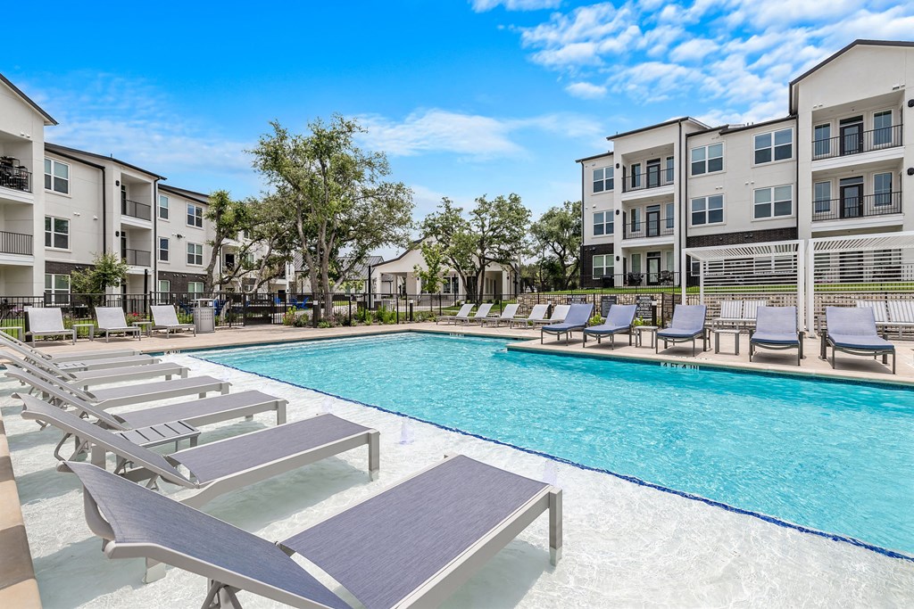 our apartments have a large pool and lounge chairs