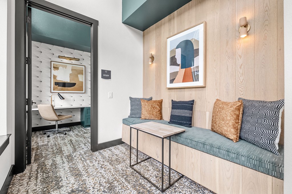 a living room with a couch and a door to a bathroom