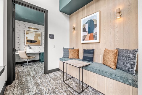 a living room with a couch and a door to a bathroom