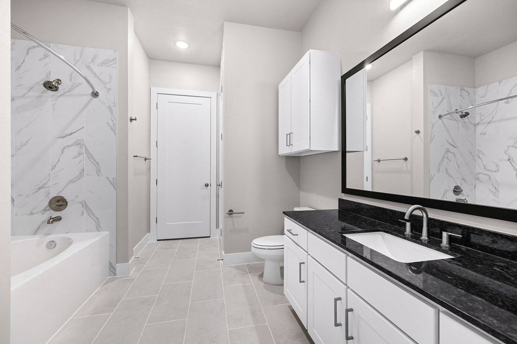 the preserve at ballantyne commons apartment bathroom with tub shower and sink