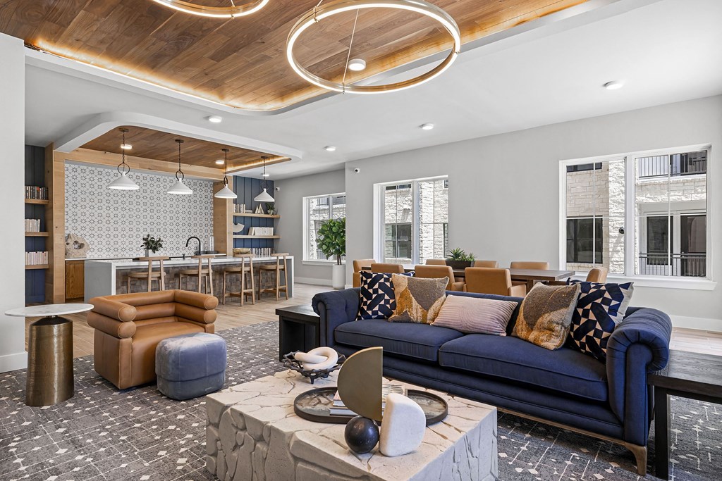 a living room with a blue couch and a table