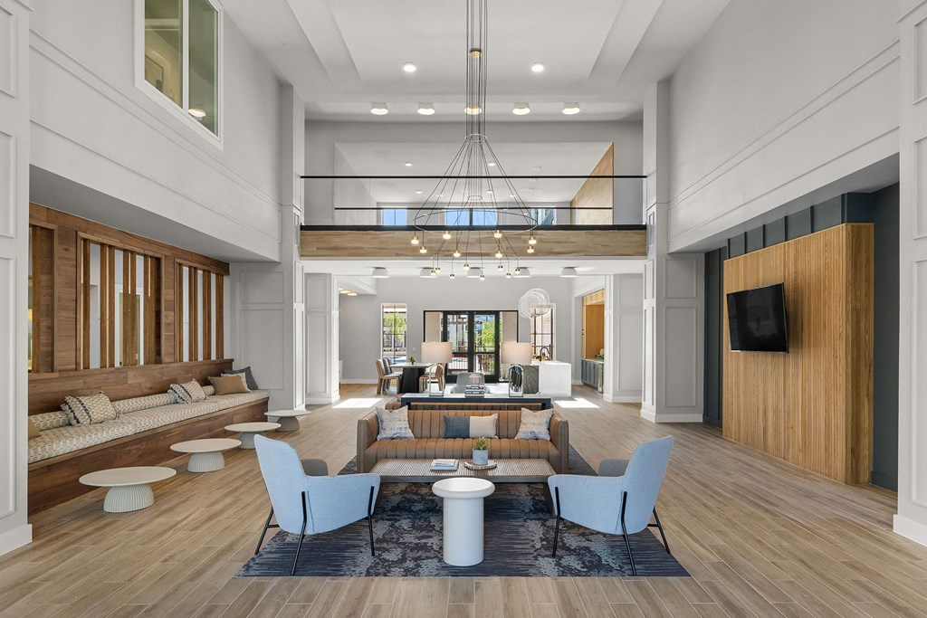 a rendering of a lobby with couches and chairs