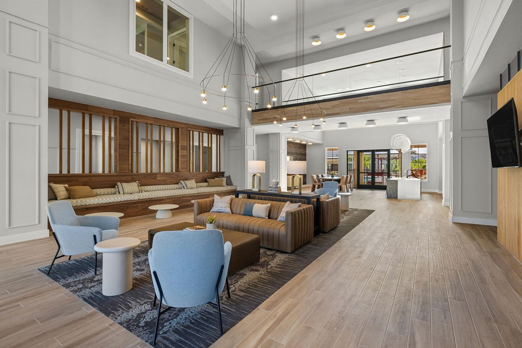a lobby of a hotel with couches and chairs