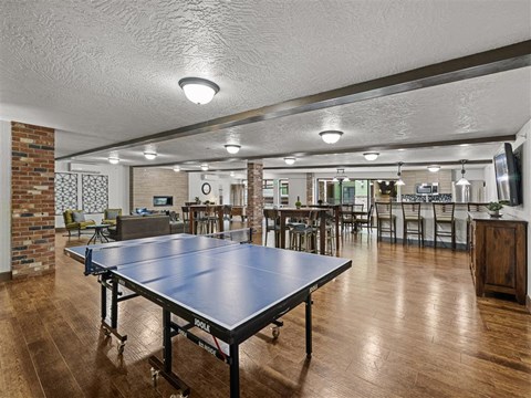 a game room with a ping pong table