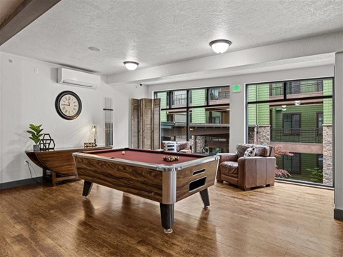 a game room with a pool table