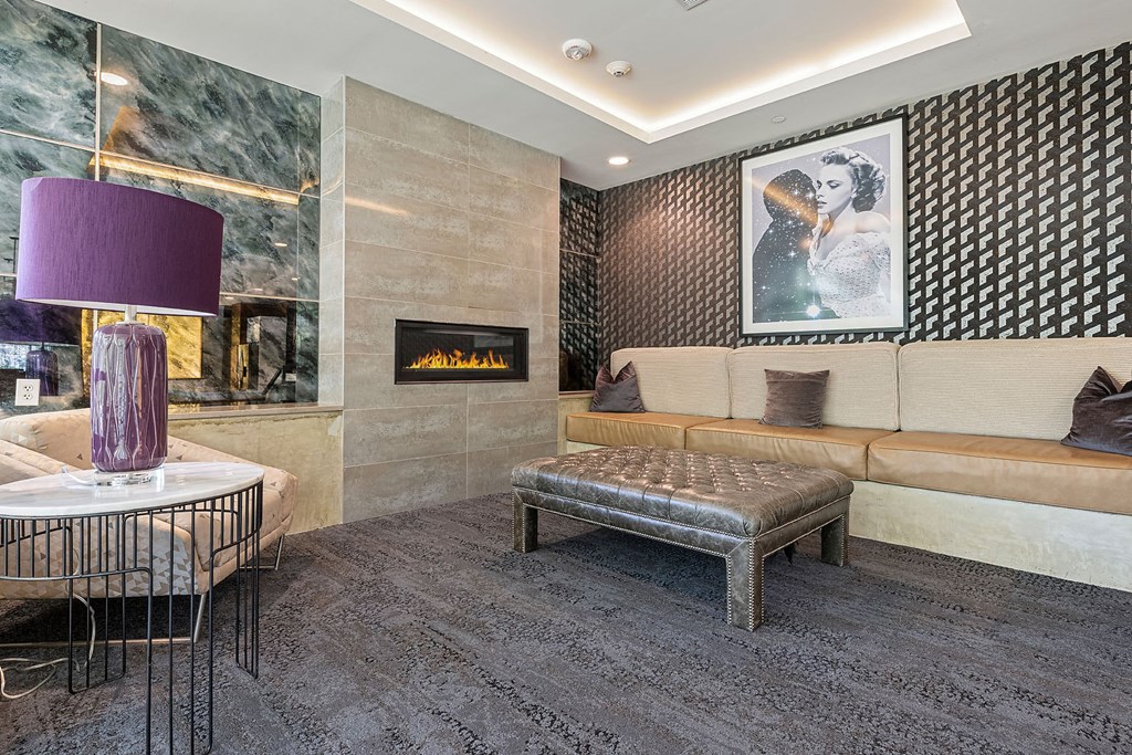 a living room with a couch and a fireplace