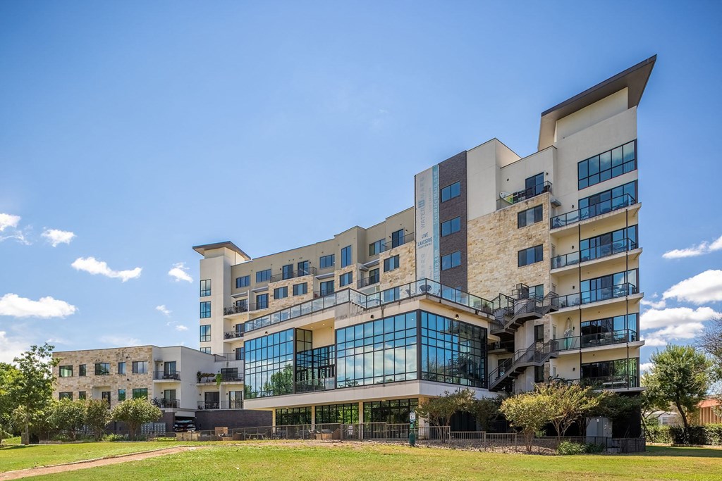a large building with a blue sky in the background