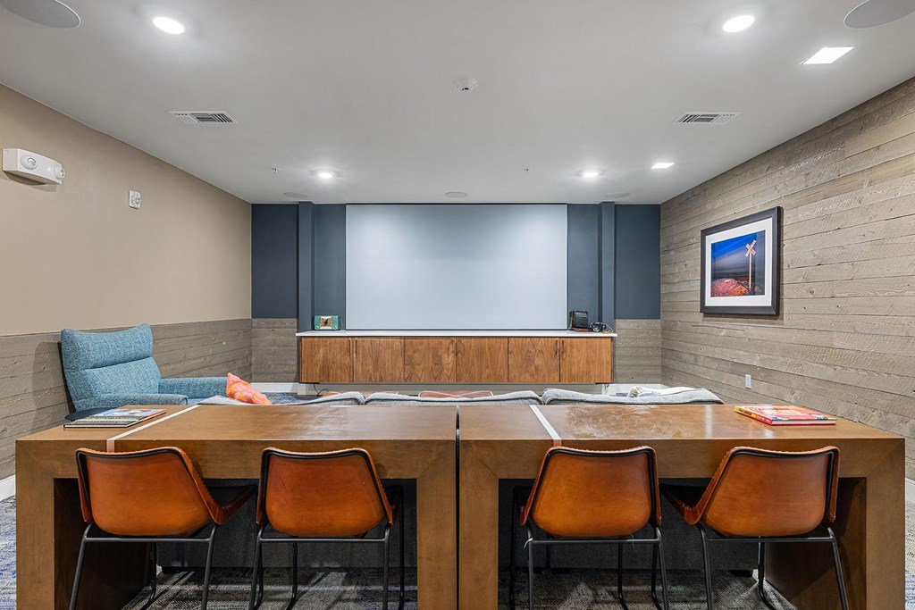 a conference room with a table and chairs