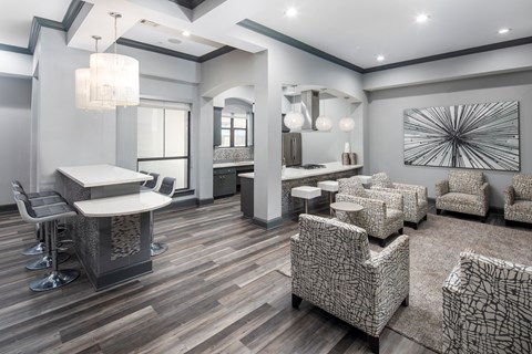 A modern living room with a bar area and patterned furniture.