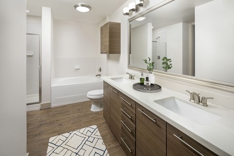 A bathroom with a white sink, a white toilet, and a white bathtub.