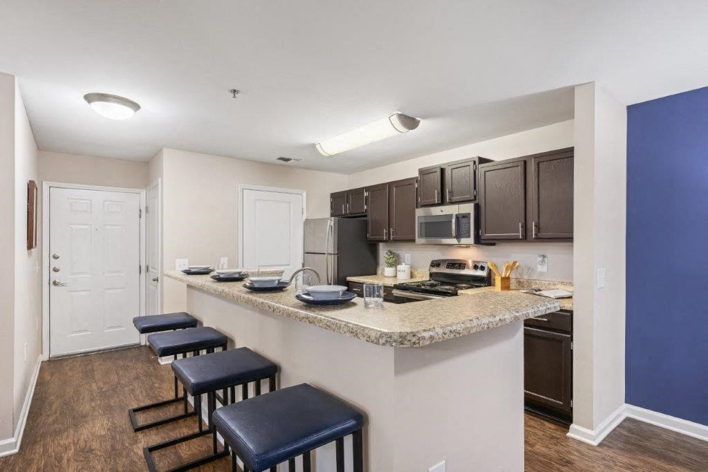 a kitchen with a counter top and a sink