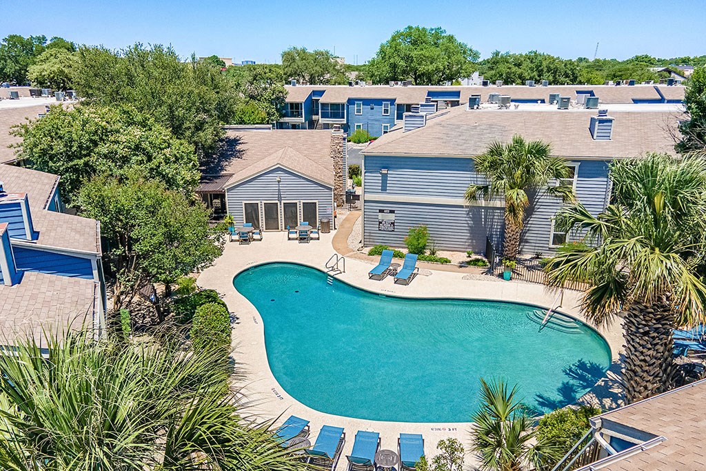 an aerial view of the resort style pool and condos