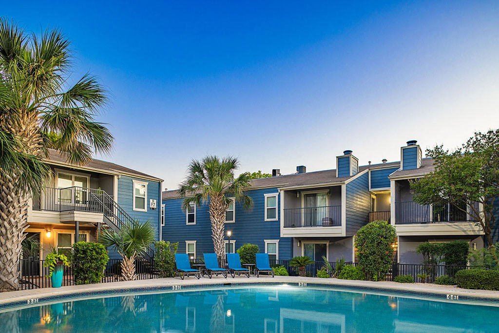 the swimming pool at the resort on a sunny day