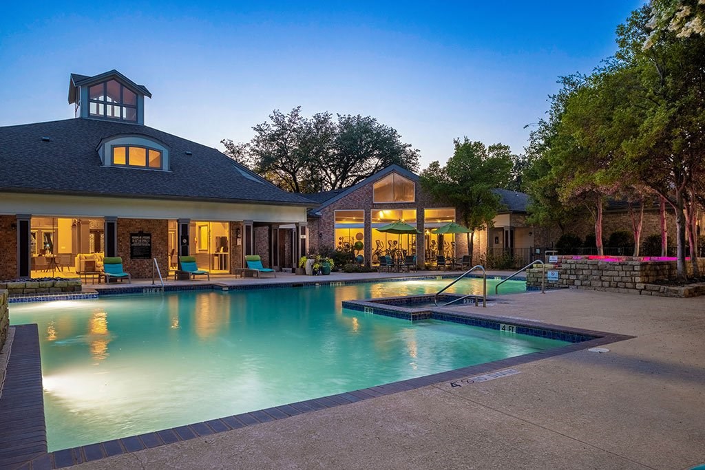a swimming pool in front of a house