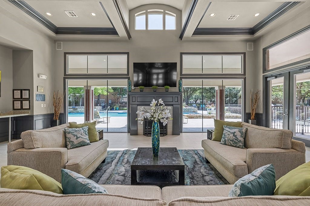 a large living room with couches and a television