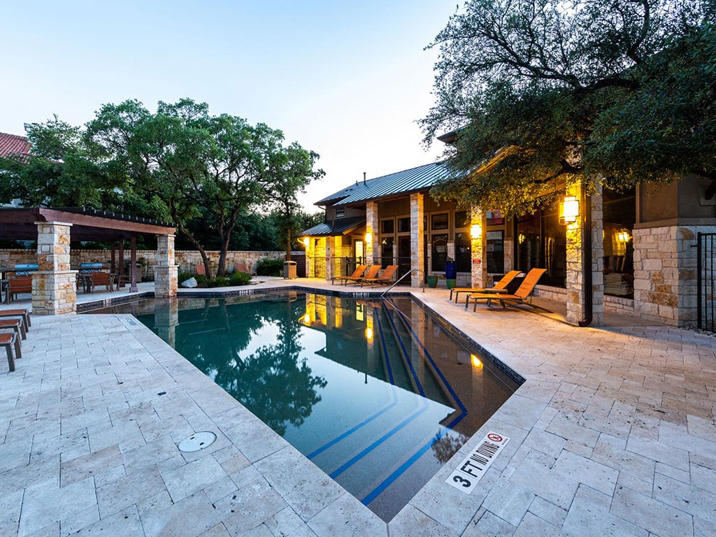 a swimming pool in front of a house