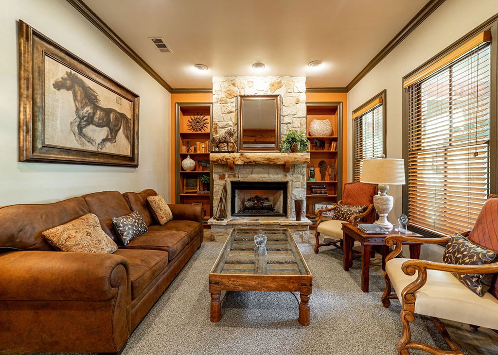 a living room filled with furniture and a fireplace