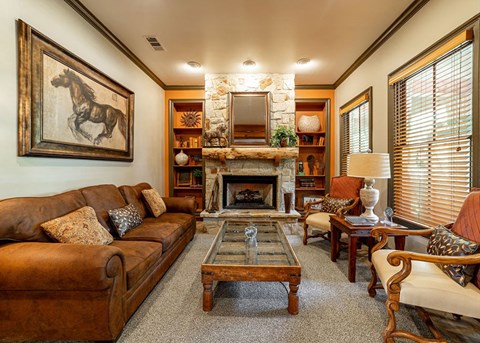 a living room filled with furniture and a fireplace