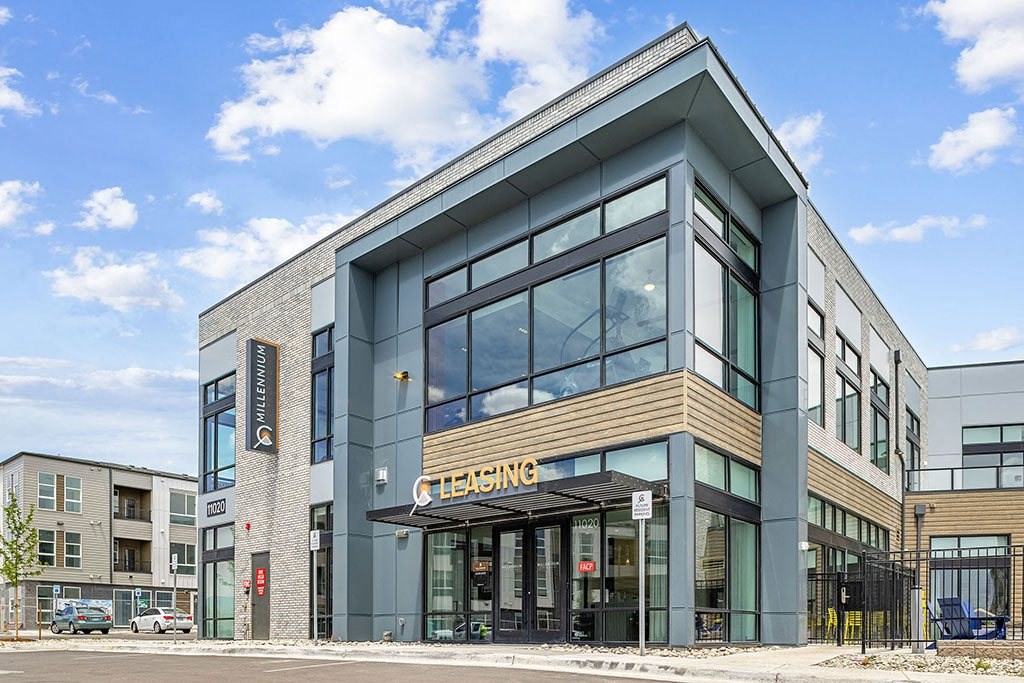 the facade of a building with large glass windows