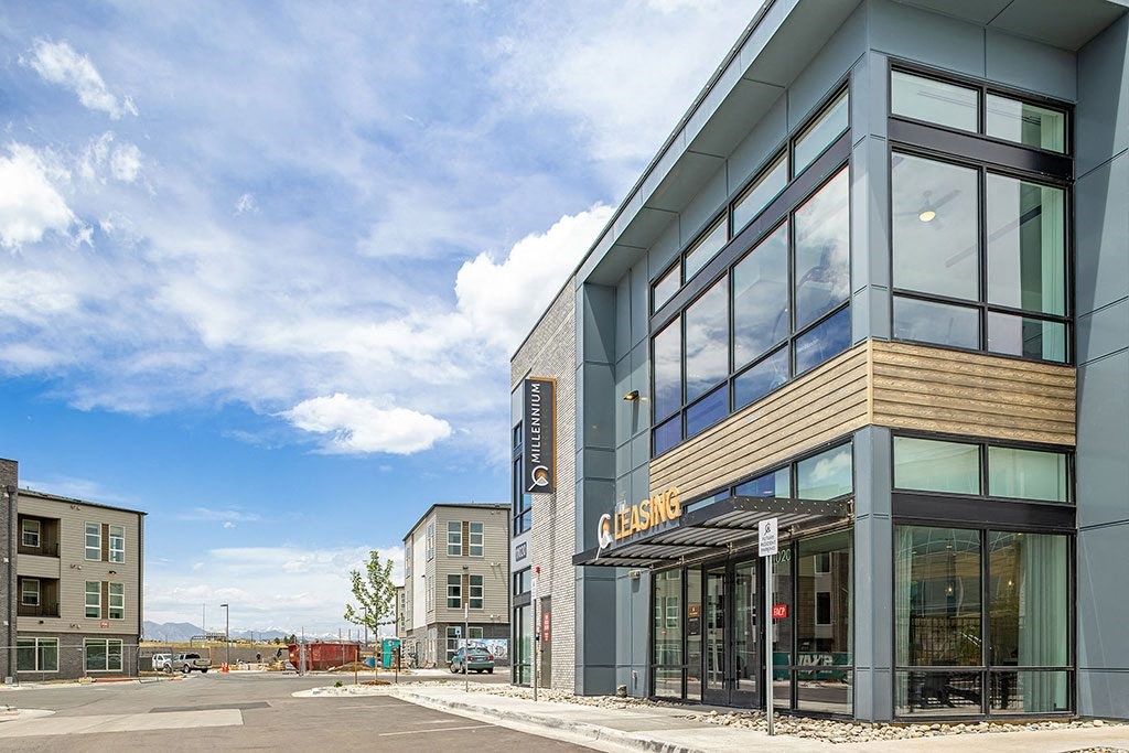 the facade of a building with large glass windows