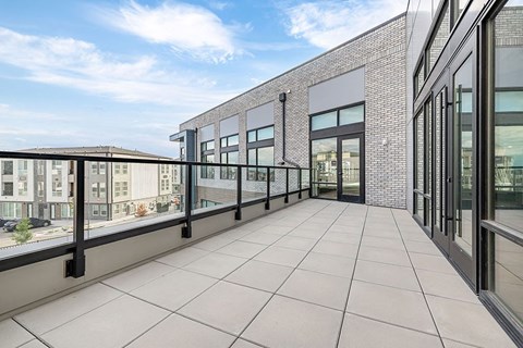 a balcony with a view of the city and a building