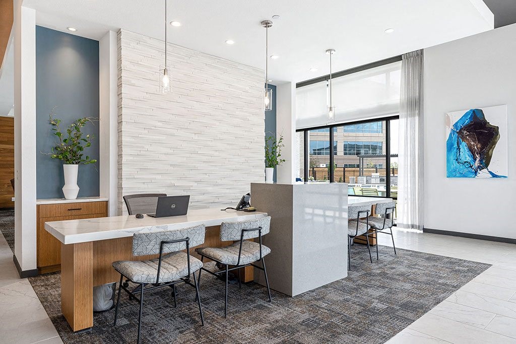a conference room with a desk and chairs