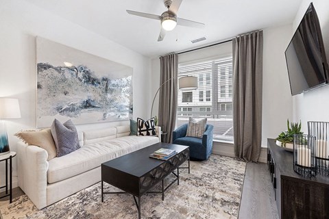 a living room with a couch and a table