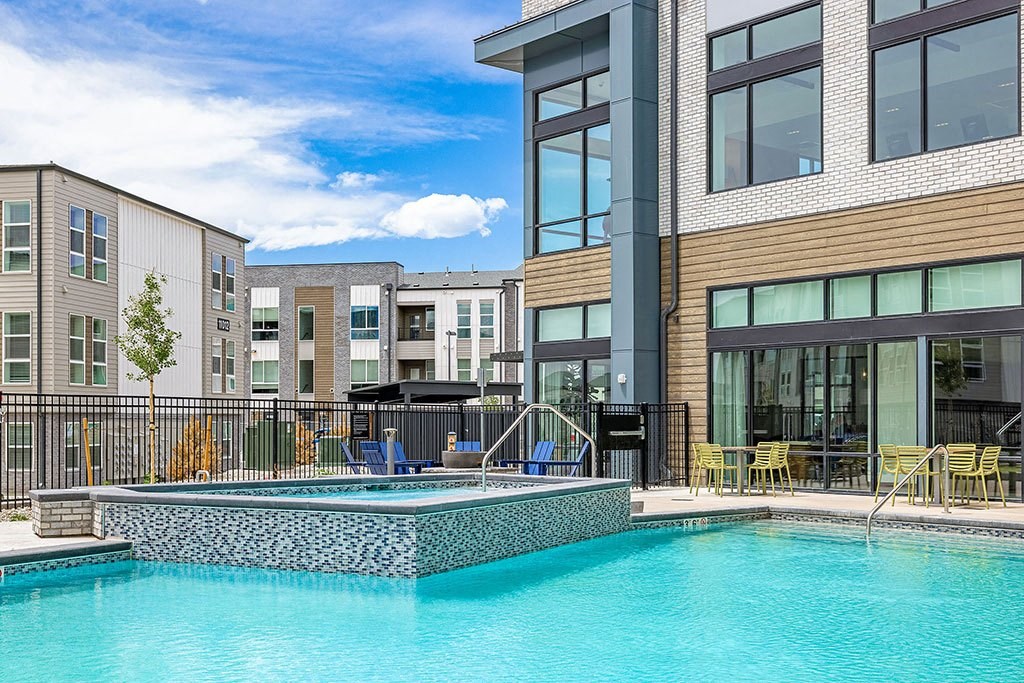 a swimming pool in front of a building