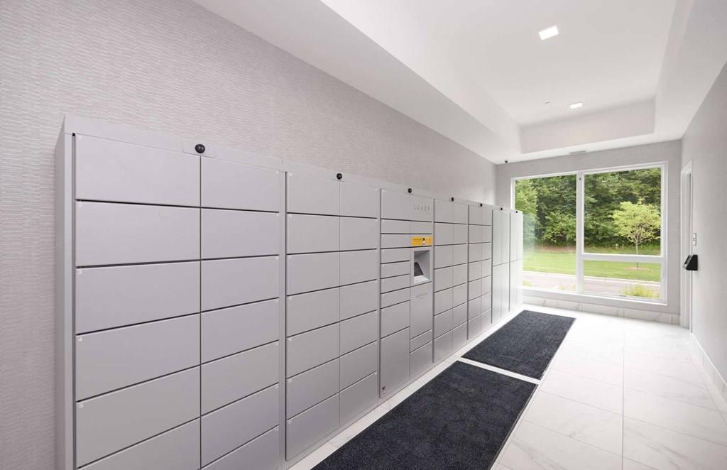 a large white locker room with a door to the yard