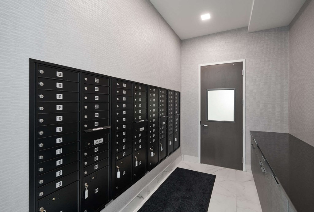 a locker room in a gym with a door to it