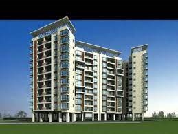 A modern multi-story residential building with balconies on each floor.