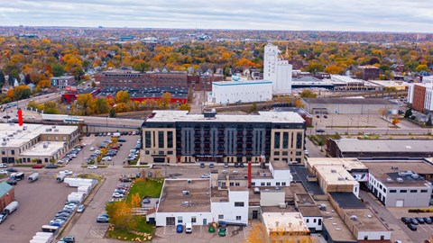 an aerial view of a city with buildings and trees