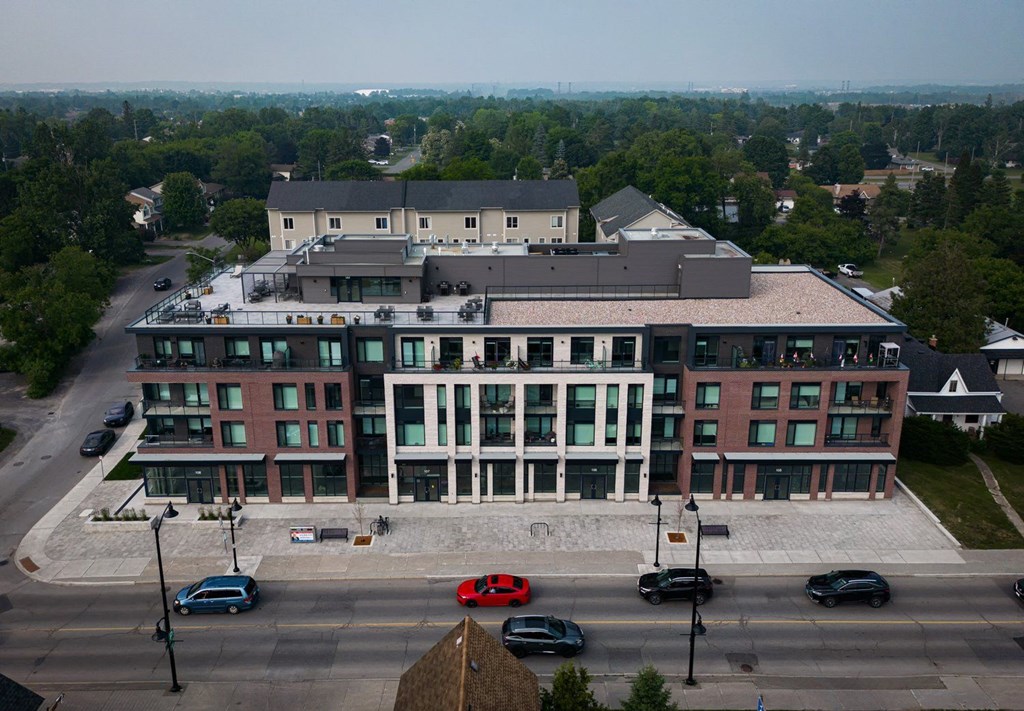 A large building with a parking lot in front of it.